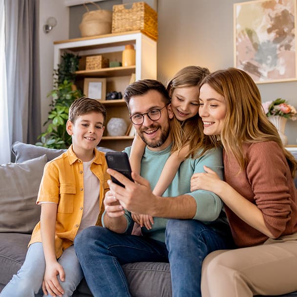 Family looking at a phone