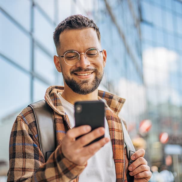 Man Using Smartphone on the Go