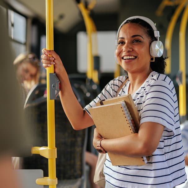 Woman on a Bus, listening to headphones